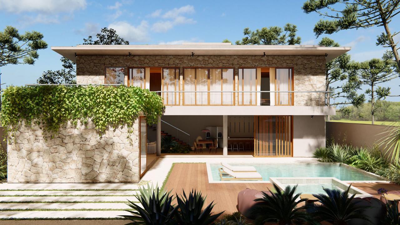 Residência com fachada em pedra e piscina — obra Gamarra